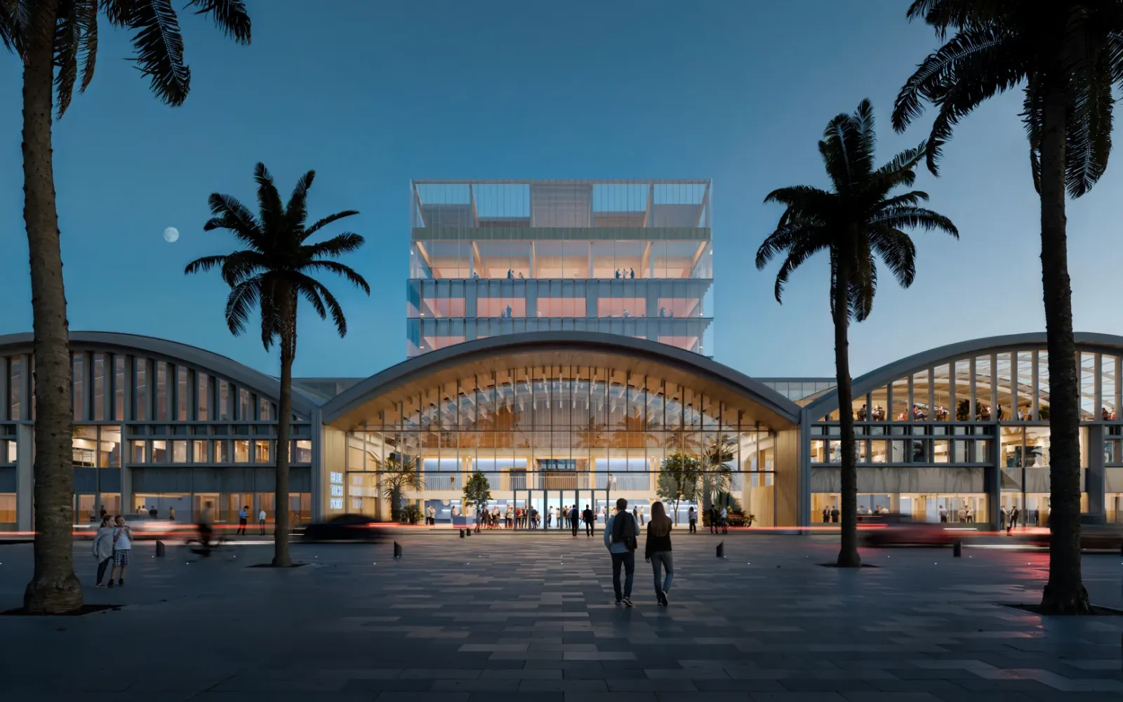 Render of the future BlueTechPort headquarters, with vaulted-roof buildings, glazed façades and a glazed tower behind, facing a palm-lined square at nightfall.