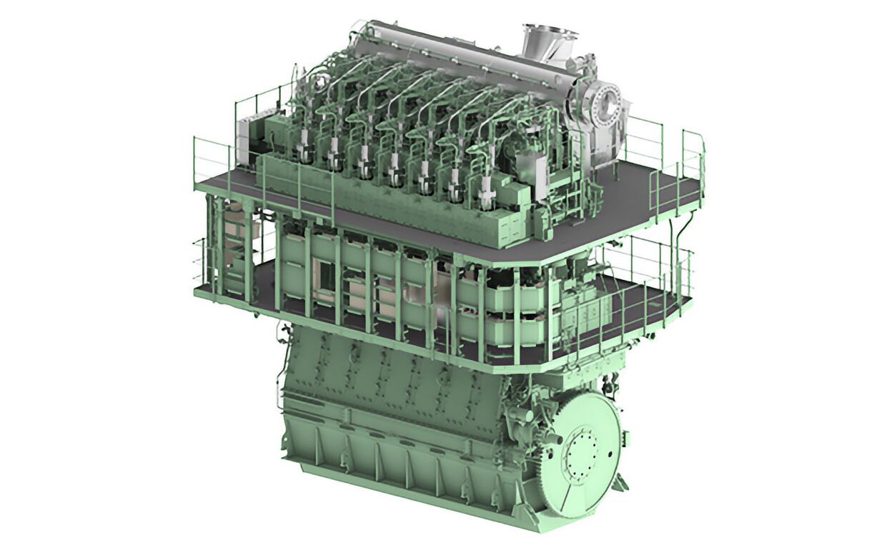 Renderització 3D de motor marí de dos temps propulsat per amoníac de Japan Engine Corporation amb plataformes d'accés i sistema de propulsió per a descarbonització marítima Renderització del primer motor comercial dissenyat per funcionar amb amoníac totalment funcional, presentat el setembre de 2025 per Japan Engine Corporation. Les dades de prova mostren que al 100% de càrrega i amb una taxa de co-combustió d'amoníac del 95%, les emissions d'òxid nitrós (N₂O) són d'aproximadament 3 ppm, aconseguint una reducció de més del 90% en les emissions de gasos d'efecte d'hivernacle (GEH). (Japan Engine Corporation)